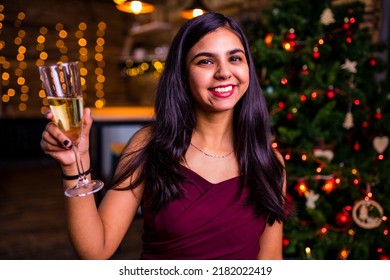 Indian Woman Drinking Alcohol At Studio Shot Spruce Christmas Tree Lights Garland Background