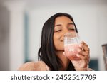 Indian woman, happy and drinking smoothie for health, nutrition and juice for detox in home. Female person, milkshake and organic ingredients for vegan diet, vitamins and minerals in protein shake