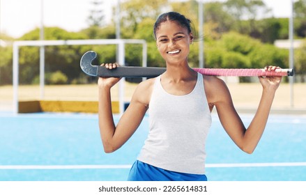 Indian woman, hockey athlete and portrait of a sport player on outdoor hockey field. Happy person, smile and and sun with a sports female ready for game training, exercise and fitness with happiness