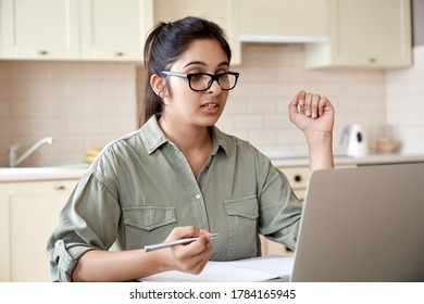 Indian Woman Online Teacher, Student, Remote Worker Video Conference Calling, Watching Webinar Training Working Learning At Home Office. Female Tutor Giving Webcam Online Class Zoom Lesson On Laptop.