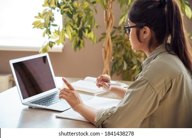 Indian woman online tutor remote school teacher, distanced office worker talking during virtual class making video call on laptop white screen teaching by conference meeting working at home classroom. - Shutterstock ID 1841438278