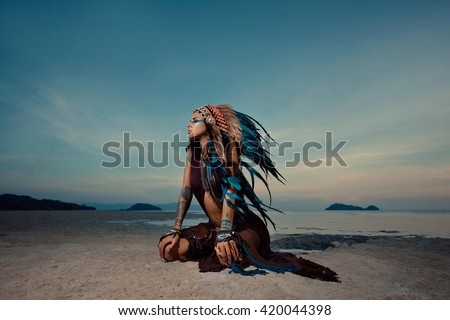 indian woman outdoors at sunset. native american style. Background with free text space
