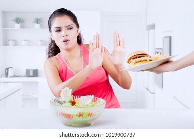 Indian Woman Refusing Junk Food And Prefer Healthy Food