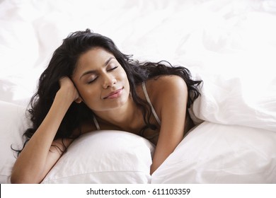 Indian Woman Relaxing In Bed