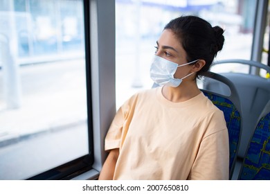 Indian Woman Ride In Public Transport Bus Or Tram In Medical Face Mask