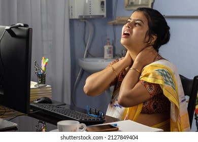 Indian Woman In Saree Working On Computer At Home And Facing Health Problem