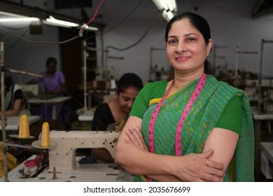 AN Indian Woman Is Standing At The Textile Factory