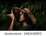 Indian woman taking picture of nature, Wildlife photographer with camera, bird photography image, adventure travel lifestyle background