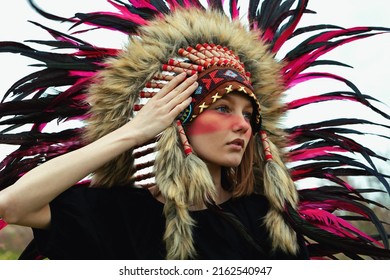 Indian Woman In War Paint On A White Background. Red Roach On The Head.