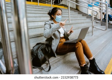 Indian Woman Wearing Face Mask Working With Laptop At Train Station Indoors