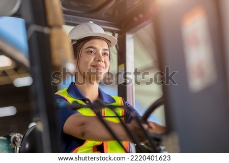 Indian woman worker warehouse forklift driver staff happy smiling enjoy working