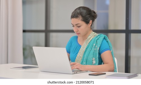 Indian Woman Working On Laptop In Office