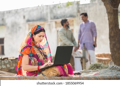 Indian Women Using Laptop At Village