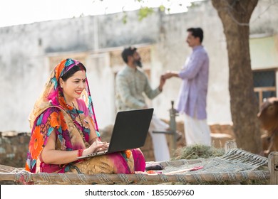 Indian Women Using Laptop At Village