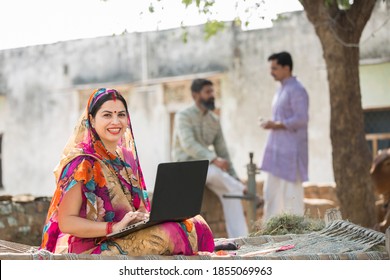 Indian Women using laptop at village