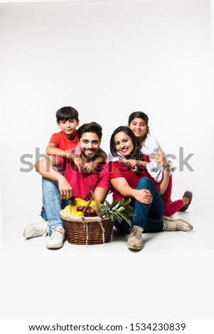 Similar – Man holding hot dog in barbecue with friends