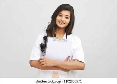 Indian Young Female Doctor Holding Notepad 