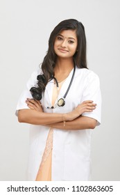 Indian young female doctor posing on white.