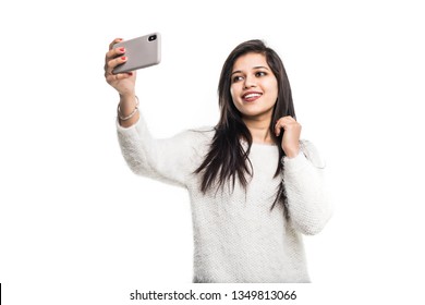 Indian Young Girl Taking Selfie With Smartphone