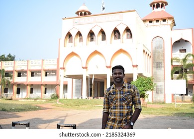 Indian Young Male College Student Standing In Front Of The College And Posing For Photo. Location: Kerala, India, Date 02-02-2022