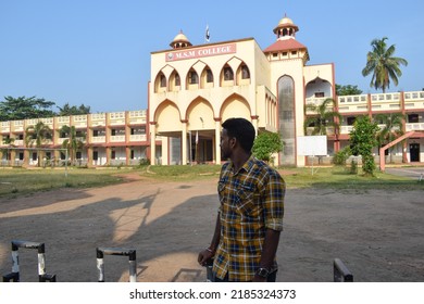 Indian Young Male College Student Standing In Front Of The College And Posing For Photo. Location: Kerala, India, Date 02-02-2022