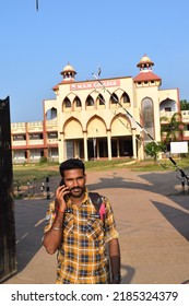 Indian Young Male College Student Standing In Front Of The College And Posing For Photo. Location: Kerala, India, Date 02-02-2022