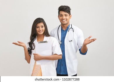 Indian young male and female doctor greeting 