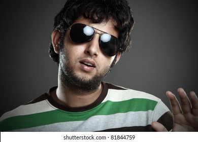 Indian young man posing to the camera.