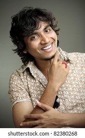 Indian young man posing to the camera.
