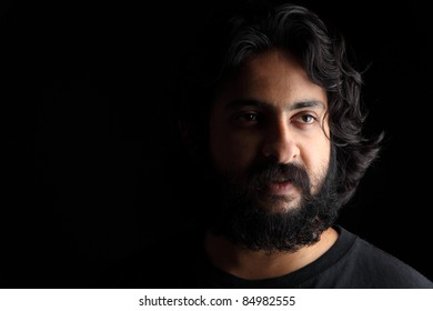 Indian young man posing to the camera.