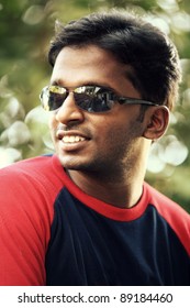 Indian young man posing to the camera.