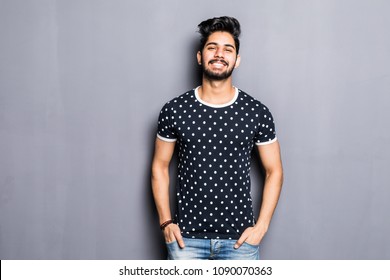 Indian Young Man In T-shirt Over Gray Background