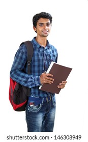 Indian young student carrying books on white.