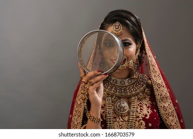 Indian young woman in ethnic wear celebrating Hindu festival 