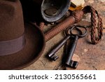 Indiana Fedora hat, whip and antique artifacts