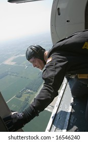 INDIANAPOLIS - AUGUST 23: A Member Of The Golden Knights Parachute Team Look Out Of The Airplane To Survey The Jump Zone At The Indianapolis Air Show On Aug. 23, 2008