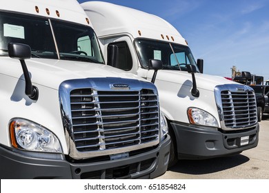 Indianapolis - Circa June 2017: Freightliner Semi Tractor Trailer Trucks Lined Up For Sale VIII