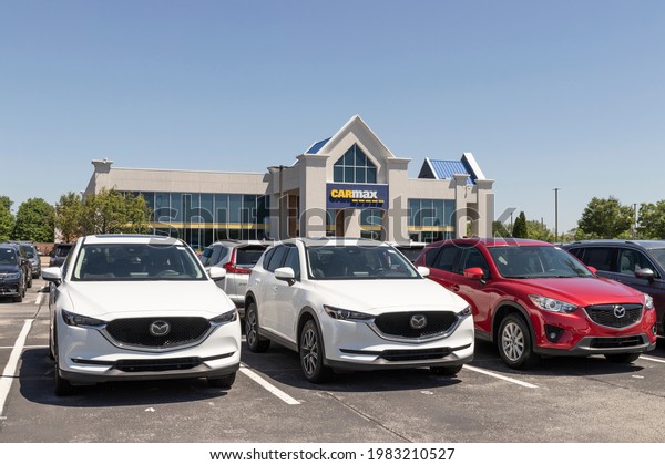 Indianapolis - Circa May 2021: CarMax Auto Dealership\
Mazda display. CarMax is the largest used and pre-owned car\
retailer in the\
US.