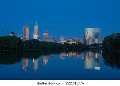 Indianapolis, Indiana skyline at night with the White River in the foreground