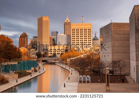 Indianapolis, Indiana, USA downtown skyline over the river walk.