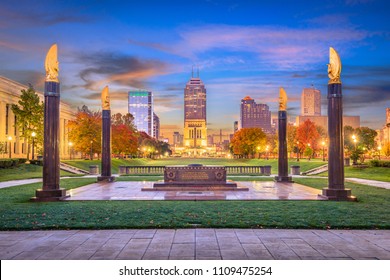 Indianapolis, Indiana, USA monuments and downtown skyline at dusk.