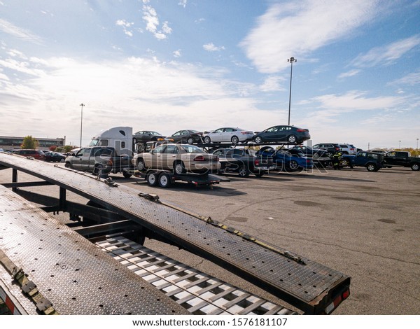Indianapolis, IN /\
USA\
Nov 15, 2019\
Car auction in Indianapolis. Car hauler ready to\
load his\
truck-trailer.