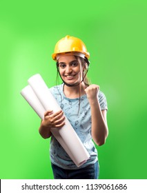 Indian/asian attractive female engineering college student wearing yellow hat and paper drawing rolls over green chalkboard background, selective focus