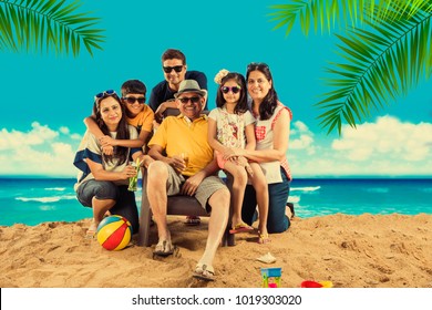 Indian/Asian Family Enjoying At Beach, Posing For Picture