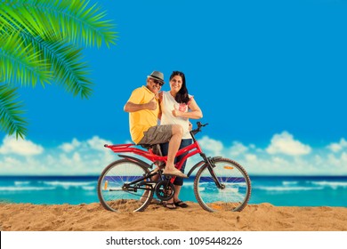 Indian/Asian Retired Couple With Their Bike/bicycle On The Beach, Moody Effect