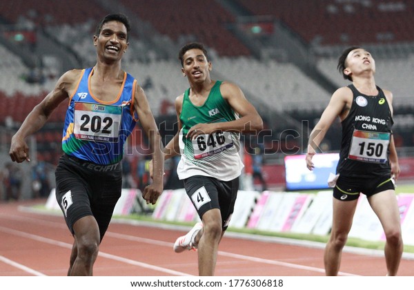 India's Narayan Thakur (L)
celebrates after winning gold medal of the men's 100 metre T35
sprint of the 2018 Asian Para Games in Jakarta, Indonesia on
October 9, 2018.