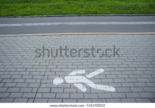 indicating road is a pedestrian walkway and\
bicycle path at the same time. Pedestrians and bikers have to be\
careful and give each other some\
space.