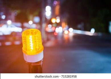 Indicator light of construction zone on the road of the night city. 
