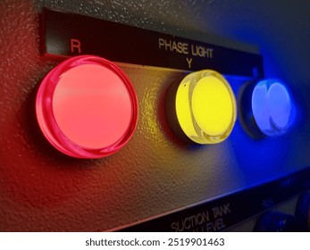 indicator phase light red yellow blue close-up view with dark background 