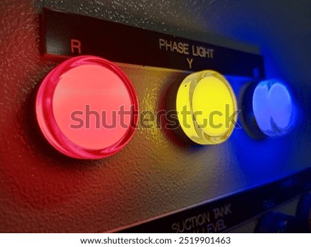 indicator phase light red yellow blue close-up view with dark background 